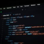 Close-up of HTML code displayed on a computer screen in dark mode, focusing on programming concepts.